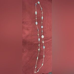 Silver 20” flapper style necklace with blue shaded beads. Can make shorter.